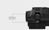 Close-up of the GAL-B laser windage and elevation adjustment screws, marked UP/D and L/R